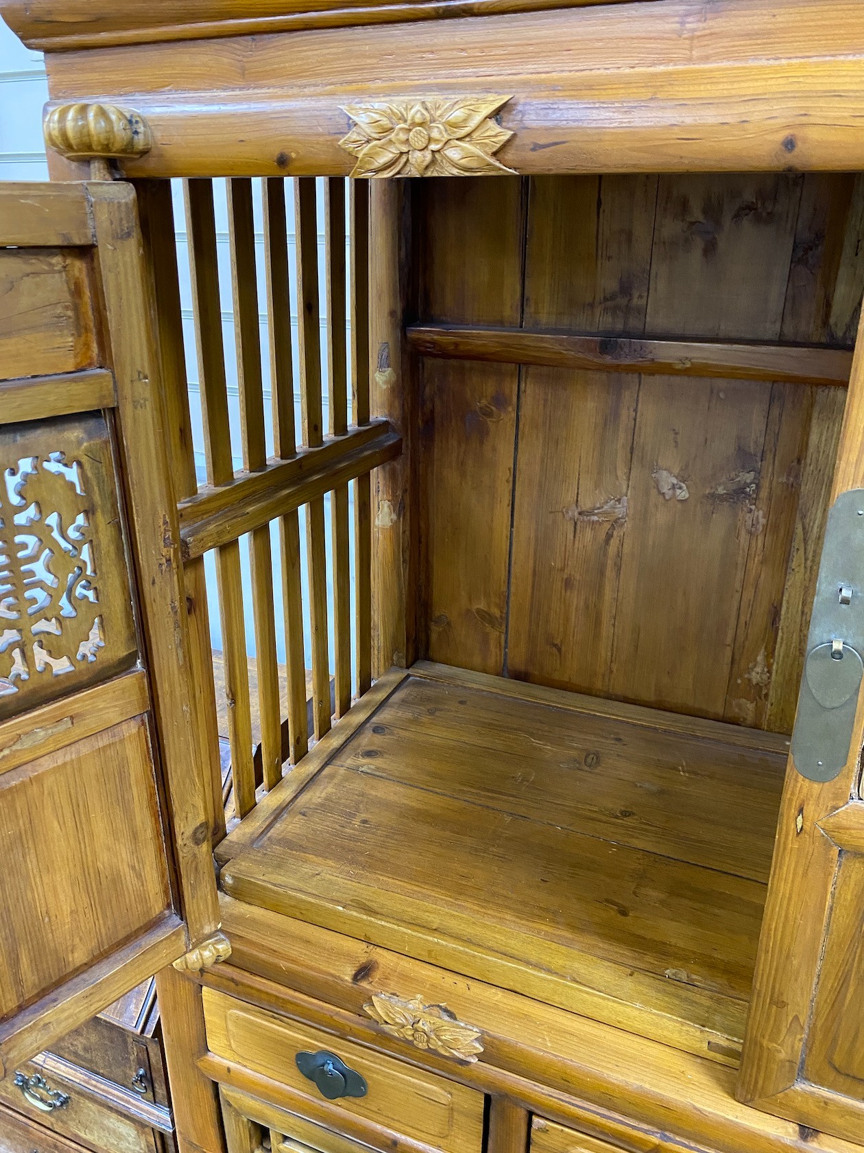 A 19th-century Chinese cypress wood side cabinet, width 106cm, depth 51cm, height 177cm